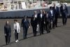 La presidenta de la Comunidad de Madrid, Isabel Díaz Ayuso (2i), y el alcalde de Madrid, José Luis Martínez Almeida (4d), junto a otras autoridades, pasean por 'la monumental', la curva peraltada que forma parte del MADRING, el circuito que acogerá del 11 al 13 de septiembre el Gran Premio de España Fórmula Uno, durante su presentación oficial este martes en Madrid. EFE/Chema Moya
