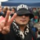 Un seguidor del cantante argentino Carlos Alberto 'Indio' Solari, fue captado este 7 de junio, al reaccionar, durante la multitudinaria despedida del artista, que falleció el pasado viernes, en el Polideportivo Municipal Gatica, en Avellaneda (Argentina). EFE/Nehuen Rovediello