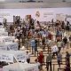 Socios llegan al pabellón de baloncesto de la Ciudad Deportiva Valdebebas para votar en las elecciones del Real Madrid, este domingo. Los socios del club toman este domingo la palabra para elegir, 20 años después de las últimas elecciones con más de un candidato, entre la continuidad de Florentino Pérez, con Mourinho, Konaté, Dumfries y un fichaje de 150 millones de euros como reclamo, o el cambio que postula Enrique Riquelme, con Haaland, Rodri y Klopp en su oferta. EFE/ Rodrigo Jiménez