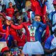 Aficionados de la selección de Haití esperan el inicio del partido contra Escocia este sábado en Puerto Príncipe (Haití). EFE/ Mentor David Lorens